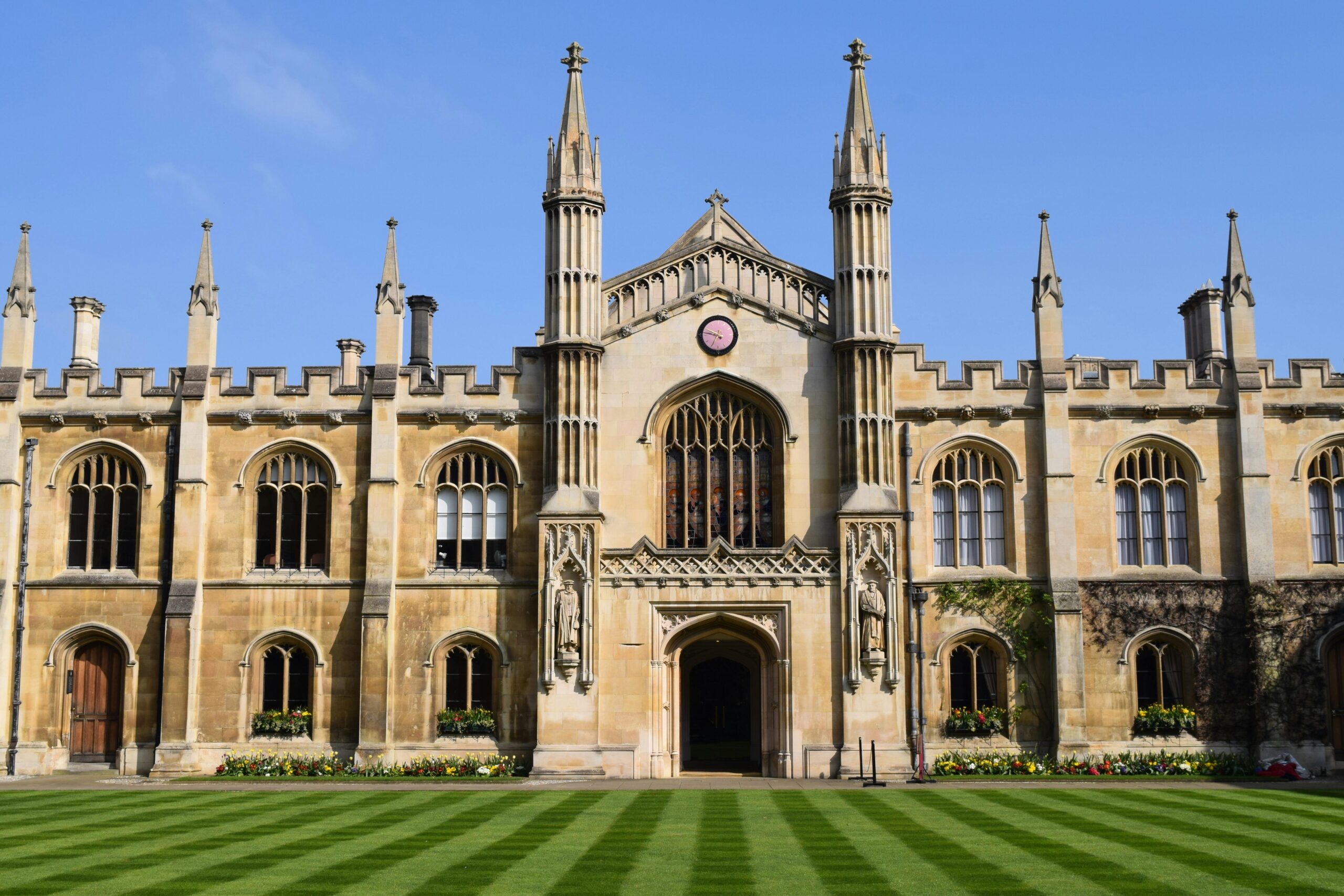 Stunning Gothic architecture of a historic Cambridge college on a sunny day.